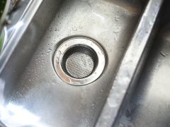clogged drain with water backup being cleaned professionally