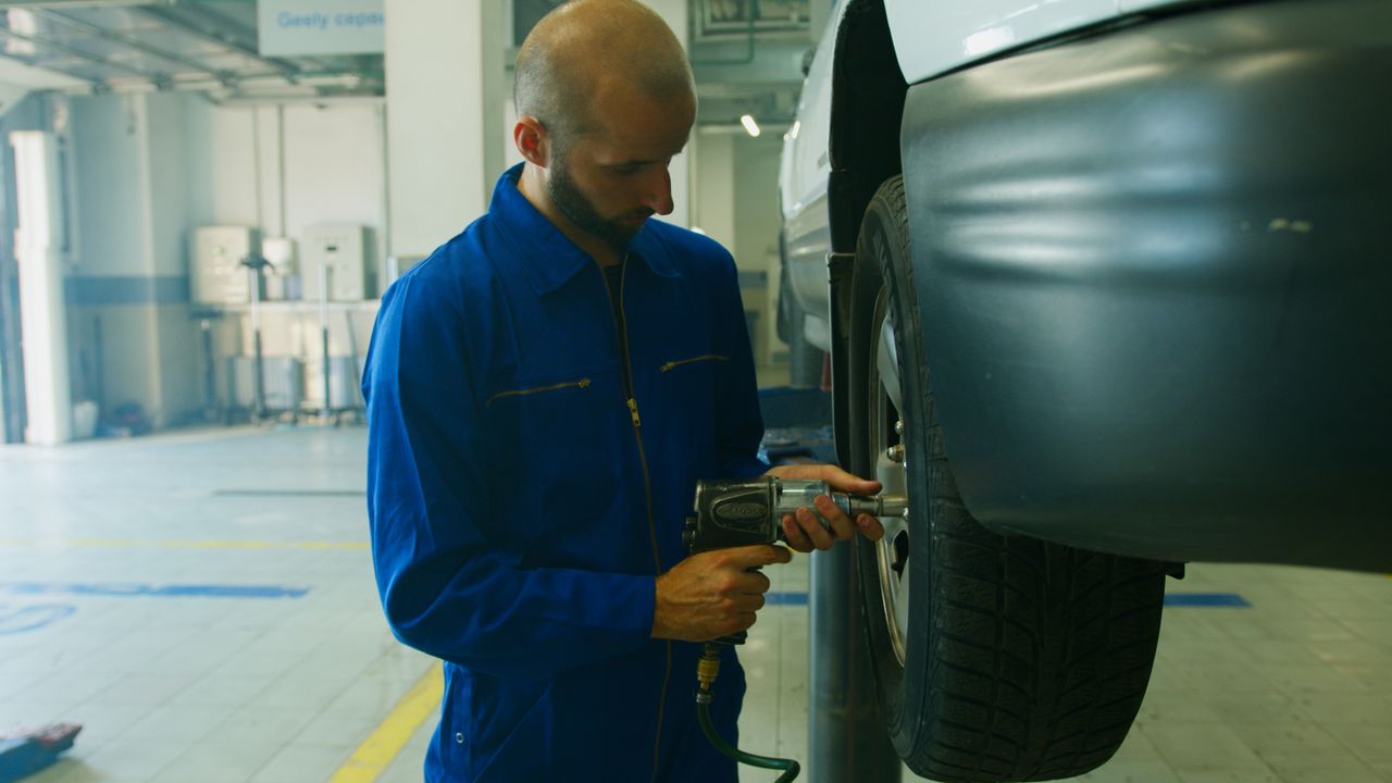 Impact wrench powered by an air compressor