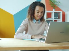 Employee organising business files on a computer